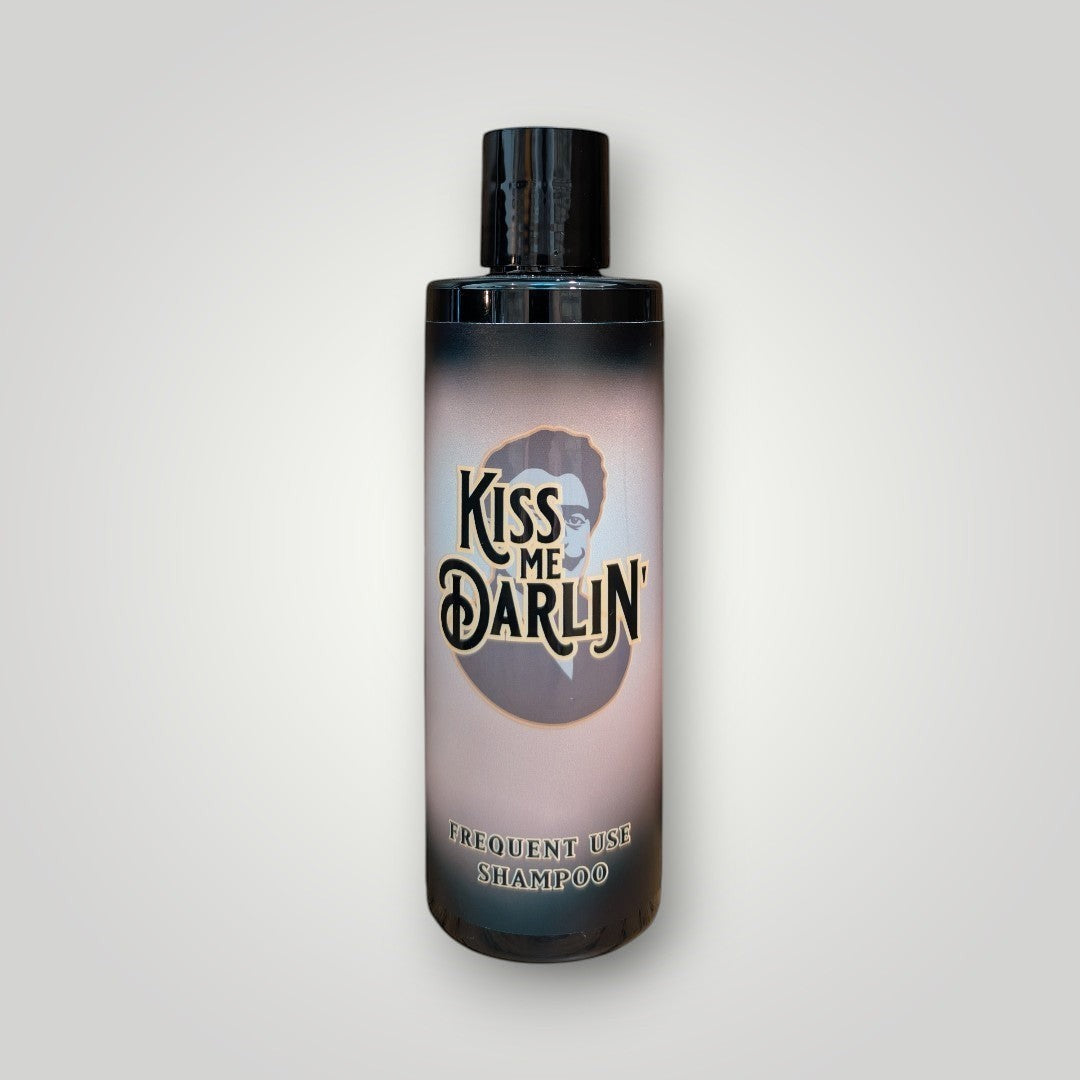 Kiss Me Darlin' Roma frequent use shampoo for all hair types, 250ml bottle with black cap and gradient label featuring a portrait.
