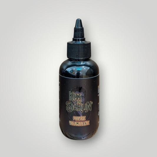 Kiss Me Darlin' Roma volumizing styling powder in a black bottle with a black applicator tip. Adds volume and fullness.